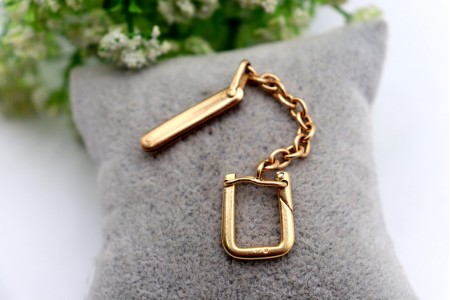 Porta chaves em ouro com canivete